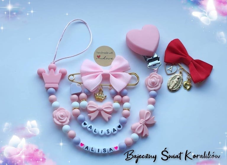 Pink and red beaded pacifier clip with Alisalisa nameplate, pink bows, heart charm, and decorative beads on light blue background